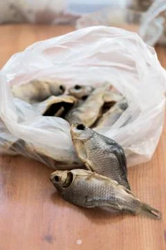 Salted dried fish is in the package. the next 2 fish . close up Stock Photos