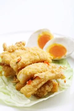 Salted egg with fried fish Stock Photos