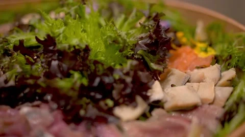 Salted fish of several types cut in a beautifully designed wooden plate Stock Footage 226761998