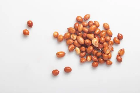 Salted fried peanuts on white background Stock Photos