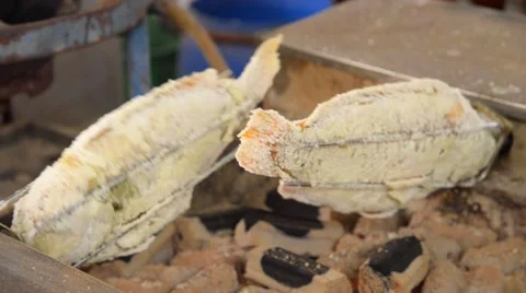 Salted Grilled fish rolling with charcoal stove Video stock 61554618