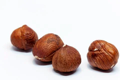 Salted hazelnuts on white background Stock Photos