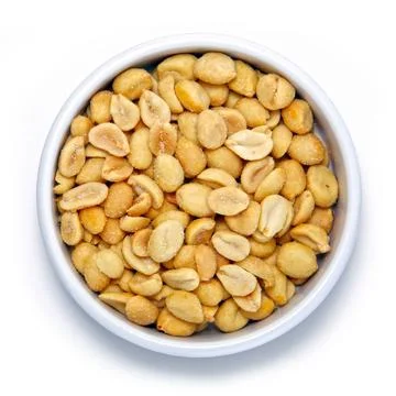 Salted peanuts in round container on white background Foto stock