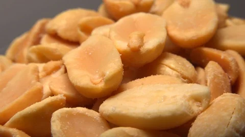 Salted peanuts spinning slowly on the table Stock Footage 121650400