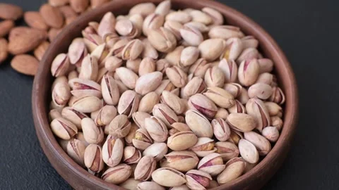 Salted pistachio nuts in shells as a healthy, high calorie food ingredient. Pist 動画素材 329889226