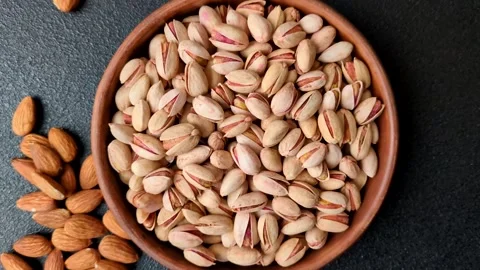 Salted pistachio nuts in shells as a healthy, high calorie food ingredient. Pist 動画素材 329889315