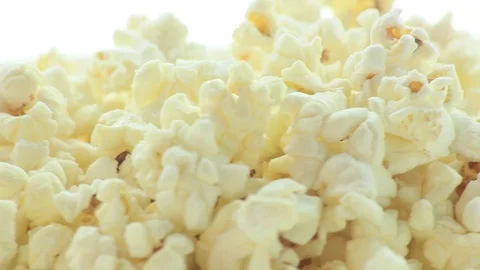 Salted popcorn rotating. Isolated on white background. Seamless loop Stock Footage 80436090