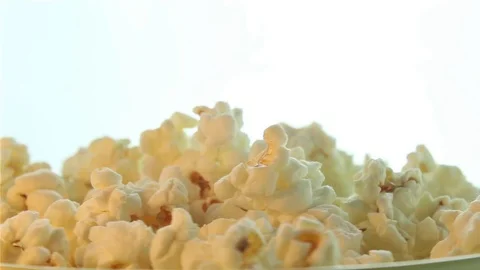 Salted popcorn rotating. Isolated on white background. Seamless loop Stock Footage 80436096