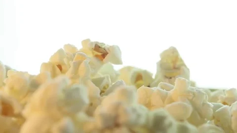 Salted popcorn rotating. Isolated on white background. Seamless loop Stock Footage 80436101