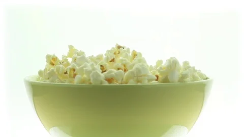 Salted popcorn rotating. Isolated on white background. Seamless loop Stock Footage 80436184