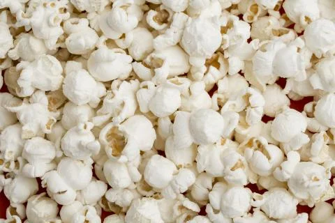 Salted popcorn, texture background. Stock Photos