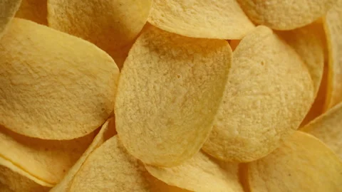 Salted potato chips, rotation. Vertical video Video stock 249868677