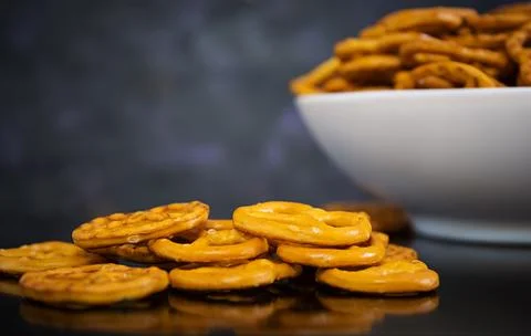 Salted pretzel on dark background Stock Photos