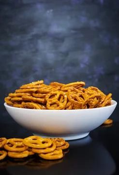 Salted pretzel on dark background Stock Photos
