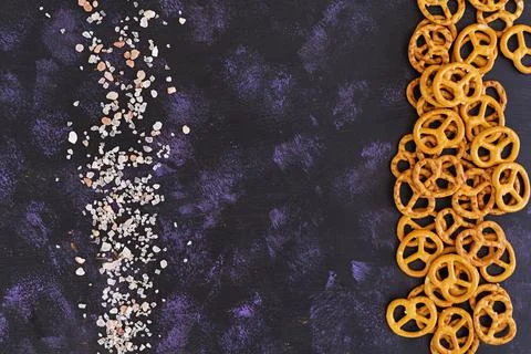 Salted pretzel on dark background Stock Photos