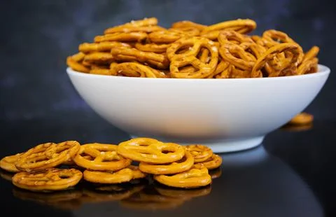 Salted pretzel on dark background Stock Photos