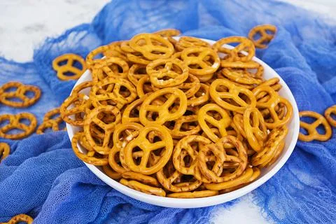 Salted pretzel on white background Stock Photos