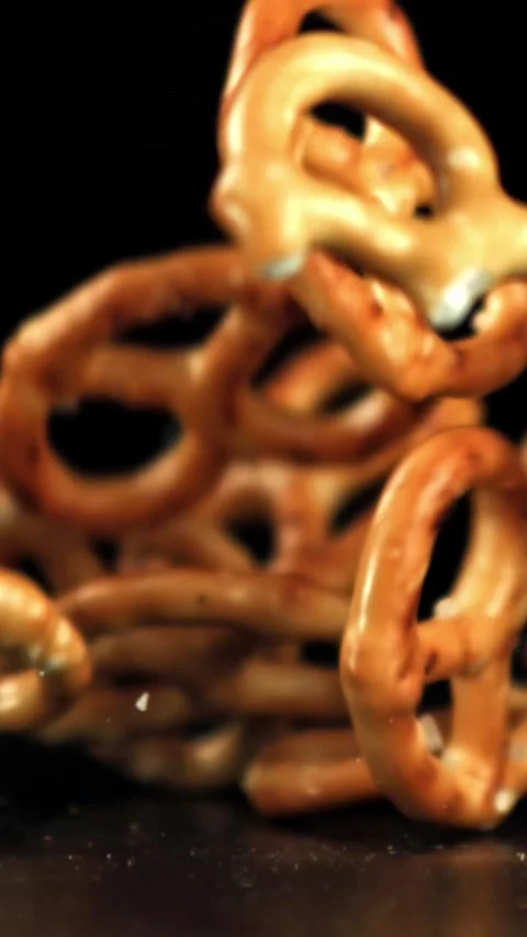 Salted pretzels fall on the table. Filmed on a high-speed camera at 1000 fps Stock Footage 335364067