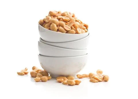 Salted roasted peanuts. Salted roasted peanuts in bowl isolated on white b... Foto stock