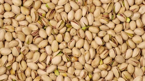 Salted roasted pistachio nuts moving background Stock-Footage 320954650