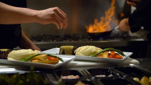 Salting a Finished Dish in a Kitchen Stock Footage 87420172