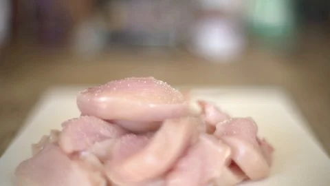 Salting &amp; Preparing Chicken in Kitchen for Meal Stock Footage 127785040