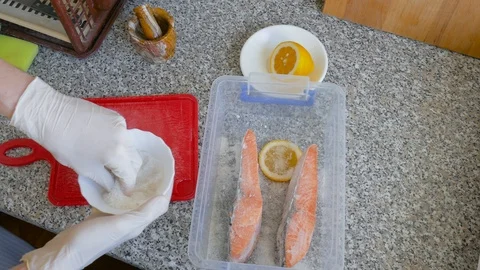 Salting of salmon slices Stock Footage 104883447