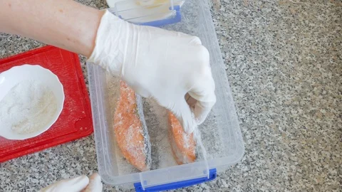 Salting of salmon slices Stock Footage 104883516