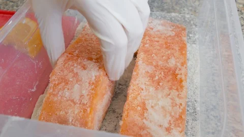 Salting of salmon slices Stock Footage 104883590