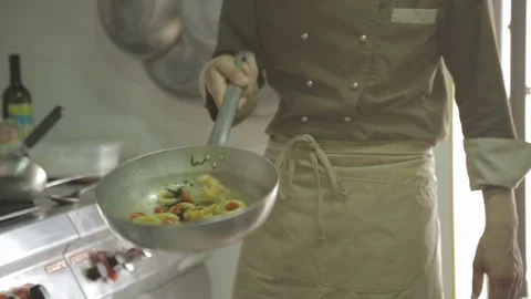 Salting seafood in a pan Stock Footage 88440714