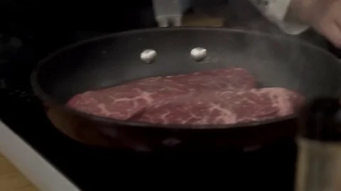 Salting steaks Stock Footage 79507358
