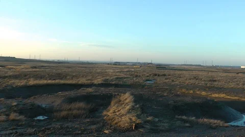 Saltmarsh zoom to ww2 bunkers Stock Footage 104312384