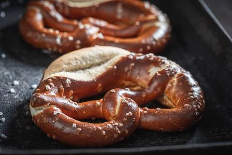 Salty and delicious pretzels as a snack for beer. Stock Photos