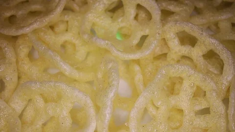 Salty snack snacks rotating seamless looping food texture pattern close up Stock Footage 103083430