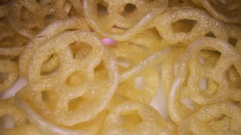 Salty snack snacks rotating seamless looping food texture pattern close up Stock Footage 103092931