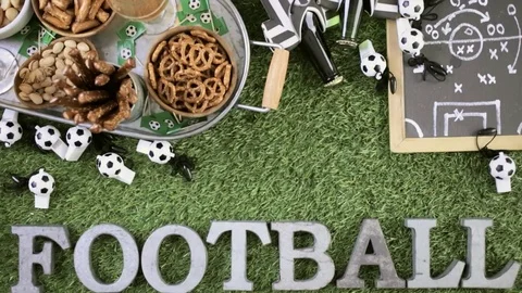 Salty snacks and drinks on the metal tray for soccer party. Stock Footage