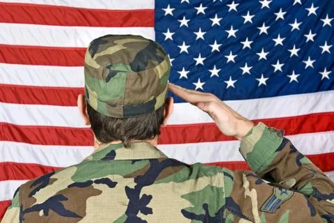 Saluting the american flag Stock Photos
