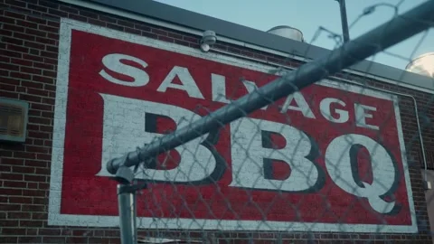SALVAGE BBQ logo on brick designed wall in Portland, Maine, USA Stock Footage 292985976