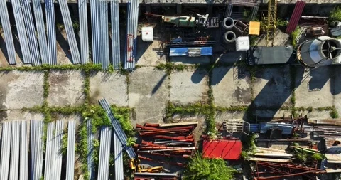 Salvage Materials Left To The Elements Outdoor Abandoned Storage Aerial Rise Stock Footage 300485334
