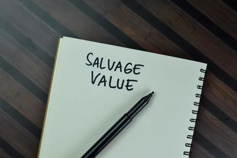 Salvage Value write on a book isolated on Wooden Table. Stock Photos