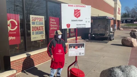 Salvation Army Bell Ringer with Face Mask Stock Footage 142967513