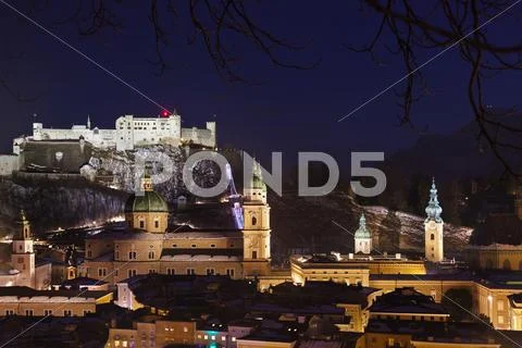 Salzburg and castle Hohensalzburg at night - Austria Stock Photos