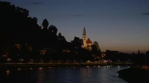 Salzburg riverside at night, Austria Stock Footage