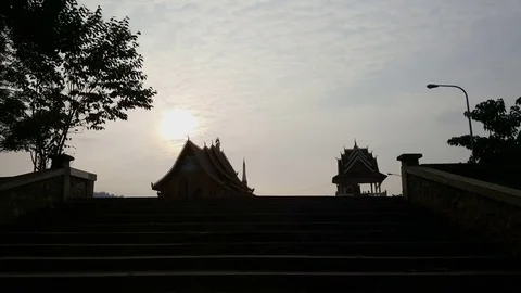 Sam Neua hill Buddhist temple and stairs silhouette, sundown, Hua Phan province Vídeos de archivo 76928142