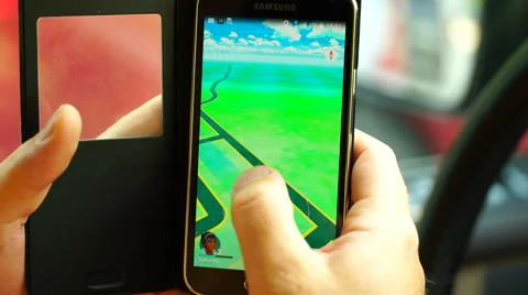 Samara, Russia - man playing pokemon go on his smartphone Stock Footage 65320997