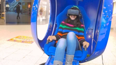 SAMARA, RUSSIA - SEPTEMBER 05, 2016 Young woman on virtual reality glasses pl Stock Footage 79548748