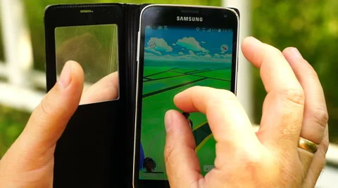 Samara, Russian man playing pokemon go on his smartphone 動画素材 65320331