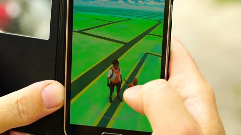 Samara, Russian man playing pokemon go on his smartphone Stock Footage 65320563
