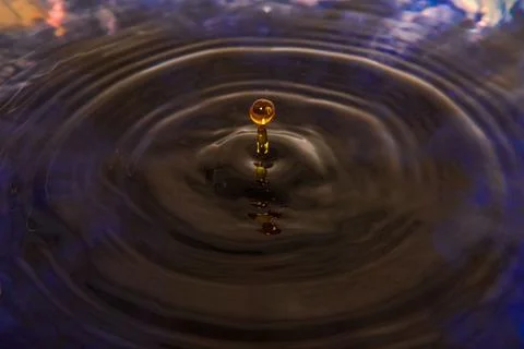 Same drop of water, the same frame, but without colorful reflection. 写真素材