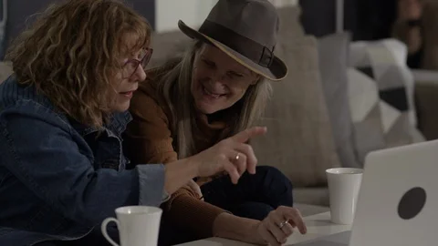 Same sex couple using computer to communicate during COVID-19 Video stock 88260731